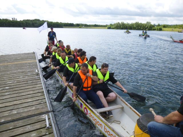 Staff make a splash in charity boat race